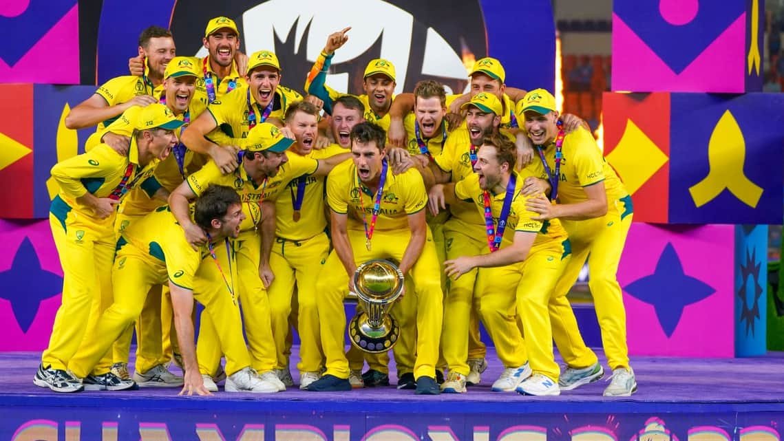 Australian players lift the World Cup.