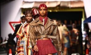 Models present creations by British-Nigerian designer Tolu Coker during London Fashion Week on 16 February