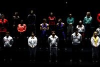 Athletes wearing the new Adidas Olympic outfits pose during the launch on 18 April