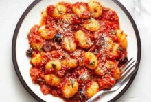 Basil gnocchi with roasted garlic tomato sauce